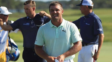 Pro golfer Bryson DeChambeau smiles on golf course