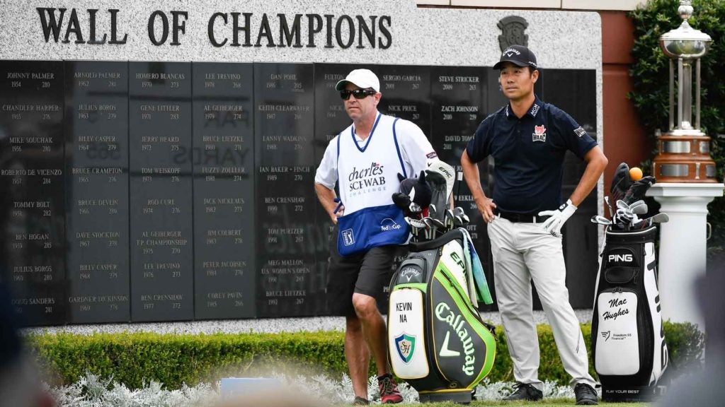 Kevin Na and caddie on golf course