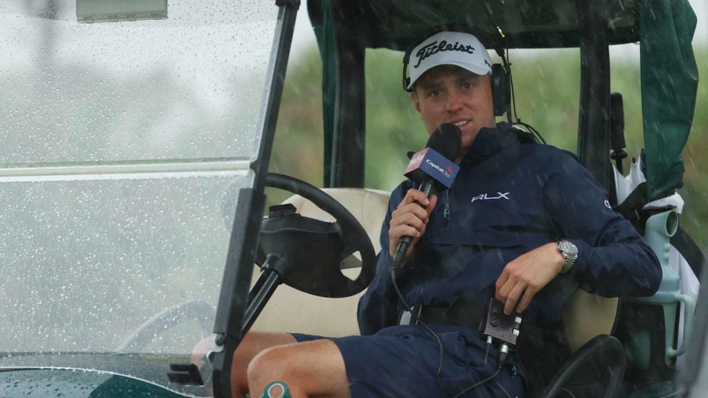 Pro golfer Justin Thomas in golf cart