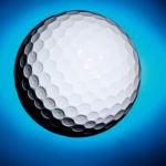 Golf ball on blue background