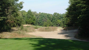 The tee shot on the par-4 11th at Pine Valley.