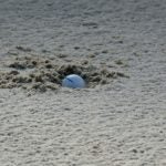 Here's a foolproof technique for escaping plugged lies in bunkers