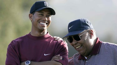 Tiger and Earl Woods smile
