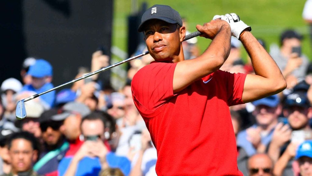 Tiger Woods watches golf shot