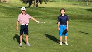 two junior golfers