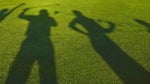 Shadow of golfers