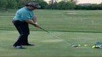 Golf instructor demonstrates drill