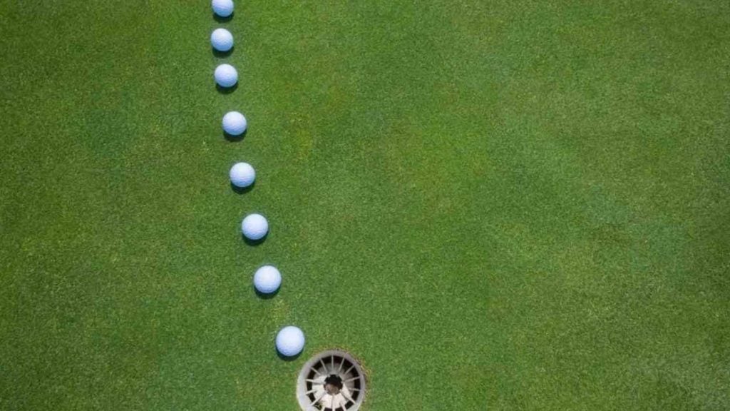Golf balls on a putting green.