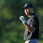 Tiger Woods catches golf ball