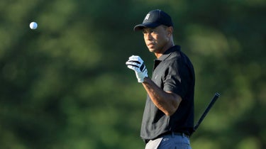 Tiger Woods catches golf ball