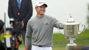 Collin Morikawa poses with the Wanamaker Trophy at the 2020 PGA Championship.