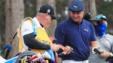 bryson dechambeau smiles after breaking driver