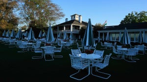 empty tables outside the augusta national clubhouse