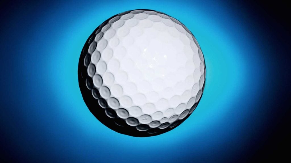 golf ball against blue and black background