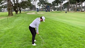 golfer swings harding park rough