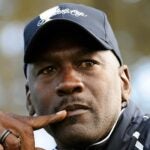 michael jordan stares with presidents cup hat