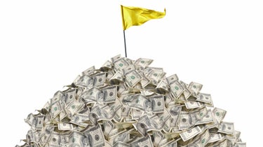 pile of cash with flagstick in it