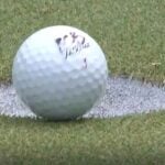 Rafael Cabrera-Bello's golf ball sits on edge of cup