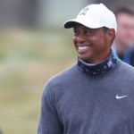 Tiger Woods smiles on Tuesday at the PGA Championship.