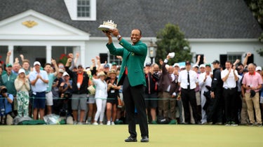 Tiger Woods holds up Masters trophy.