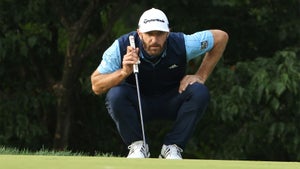 Dustin Johnson reads a putt on Friday at Winged Foot.