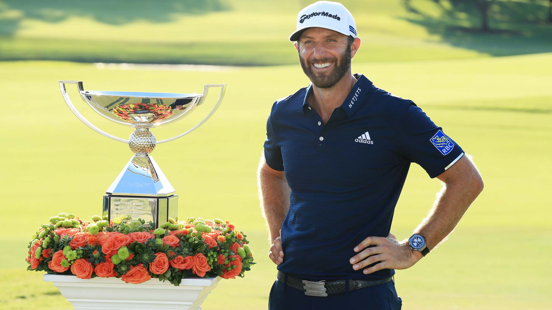 dustin johnson with trophy.