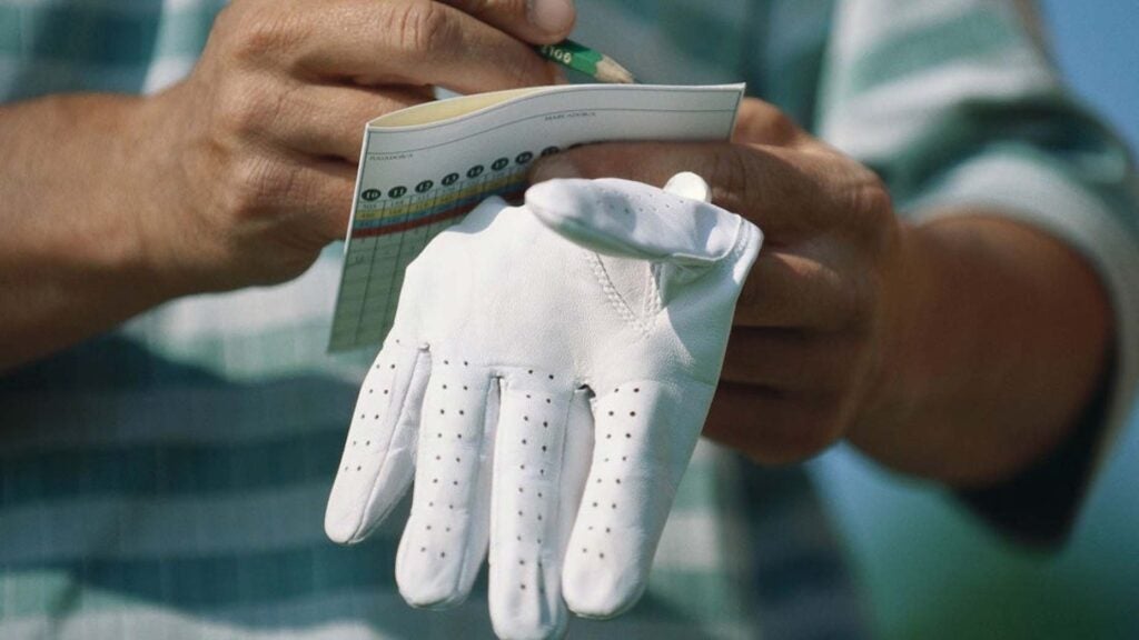 hand with scorecard
