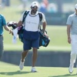 Jordan Spieth, Michael Greller and Justin Thomas walk down the fairway during the 2018 Players Championship.