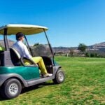 players in golf cart