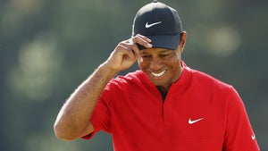 Tiger Woods acknowledged a smattering of applause on the 18th green.