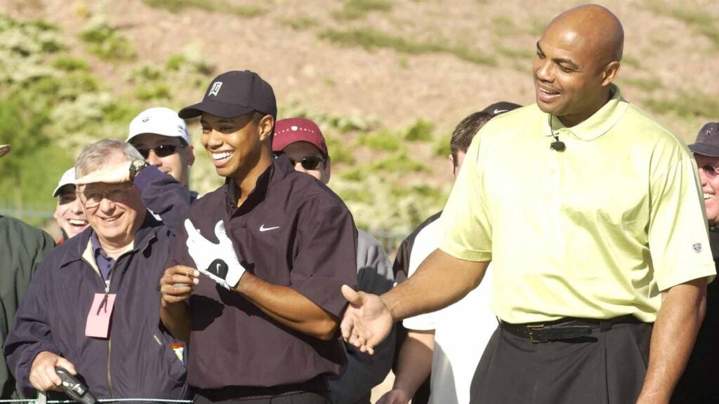 Charles Barkley and Tiger Woods play golf