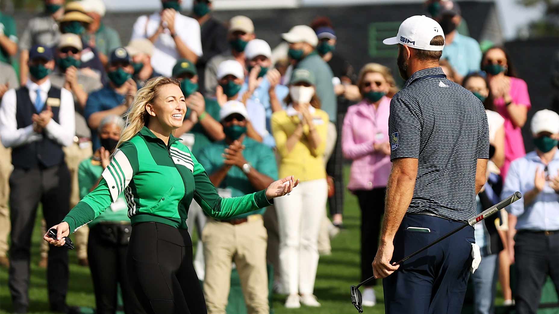 Dustin Johnson and Paulina Gretzky hug.