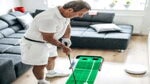 man practicing golf at home