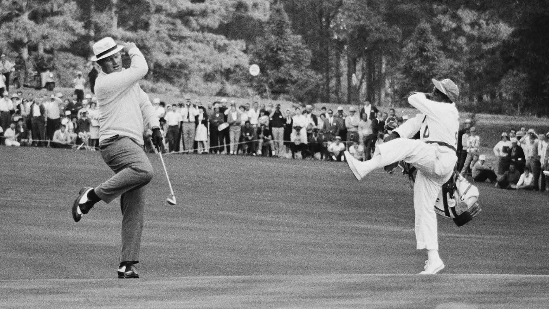 Jack Nicklaus and his caddie celebrate at the 1966 Masters.