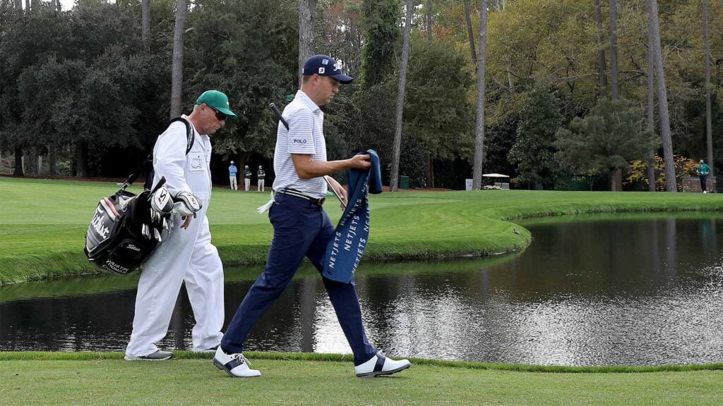 Justin Thomas and his caddie during the first day of the Masters