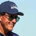 phil mickelson smiles navy hat