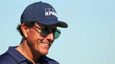 phil mickelson smiles navy hat