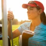 woman with golf clubs