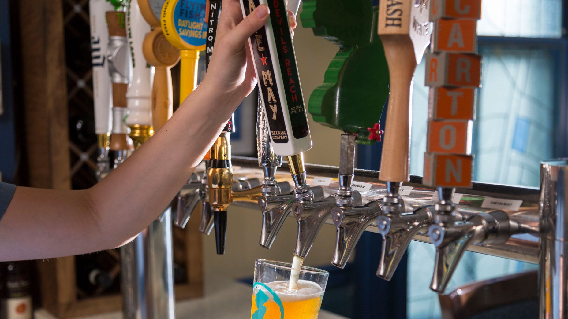 Tap beer. In a glass.