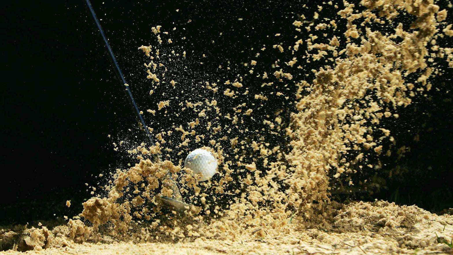 Is there a penalty for accidentally hitting a buried ball in a bunker?