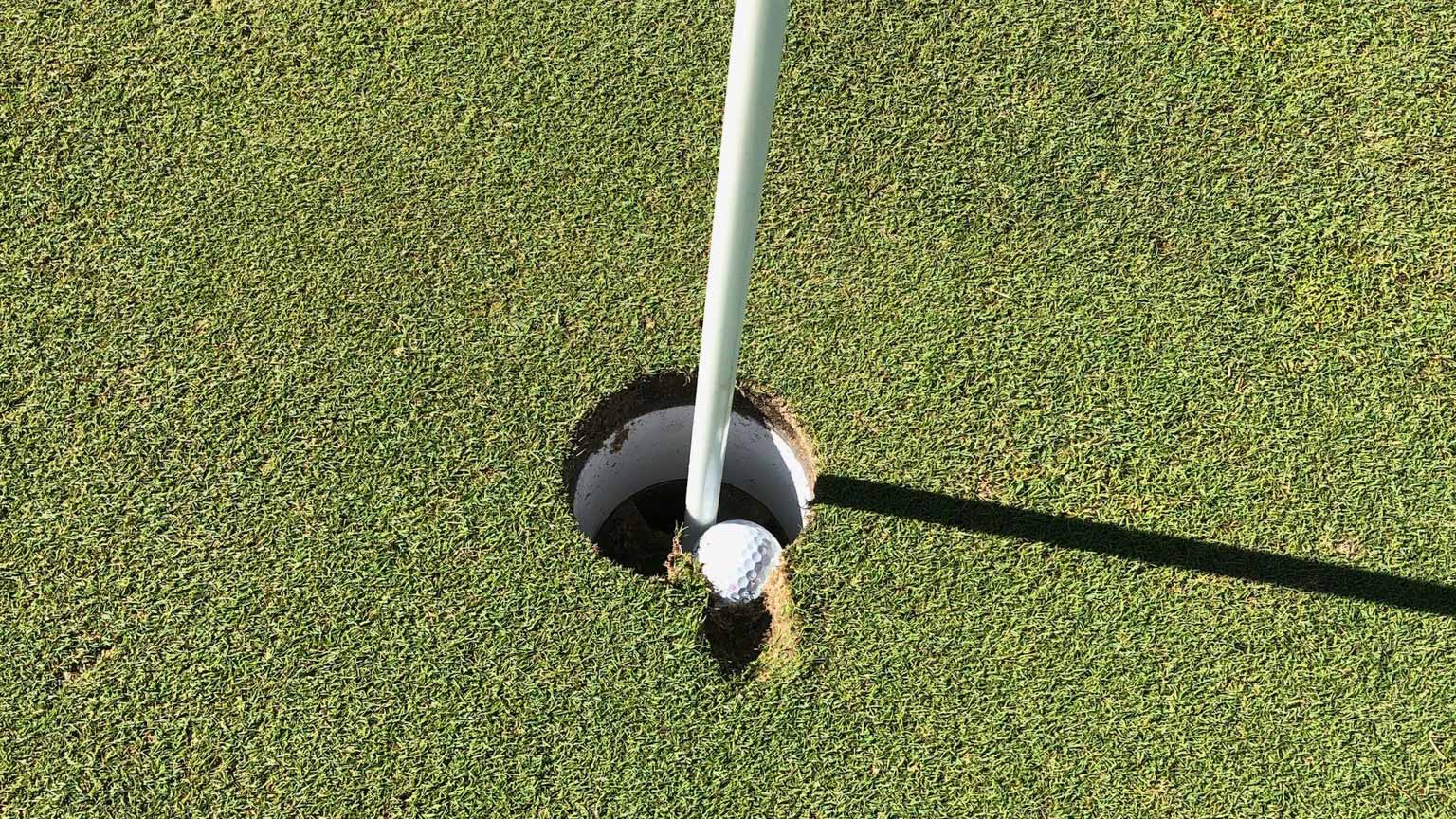 Is this golf ball embedded in the cup a hole-in-one? Here's what we learned