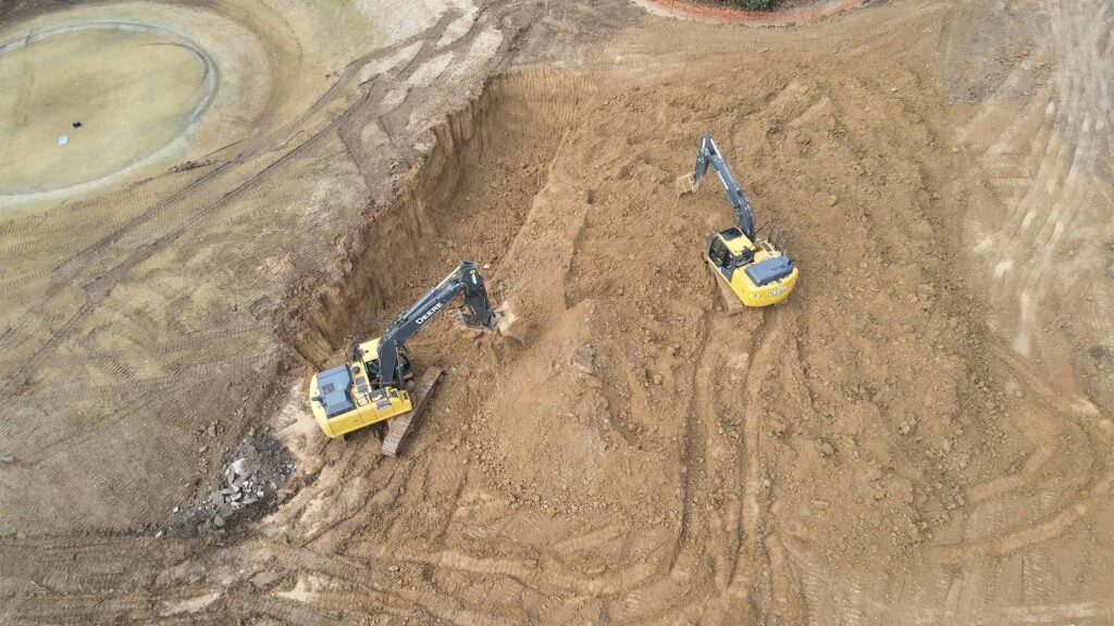 Diggers get to work on bury pits.