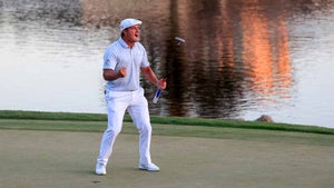 Bryson DeChambeau celebrates his victory on the 18th green at Bay Hill.