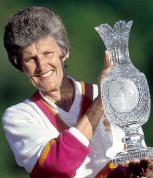 Kathy Whitworth hoisting the Solheim Cup in 1990.