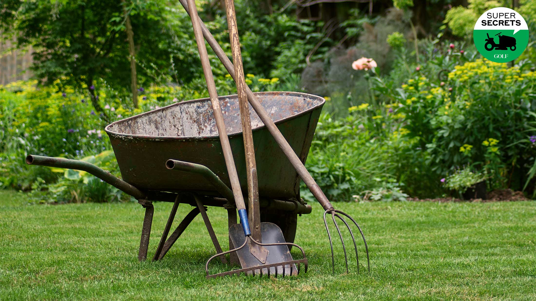 wheelbarrow with lawn tools