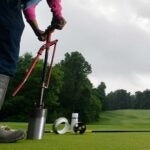 superintendent clipping a hole