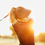 Woman golfer backswing