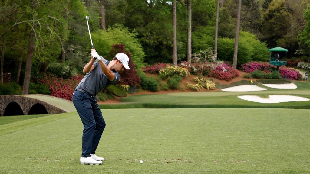 Patrick Cantlay hits his tee shot to the par-3 12th green at Augusta National on Thursday.