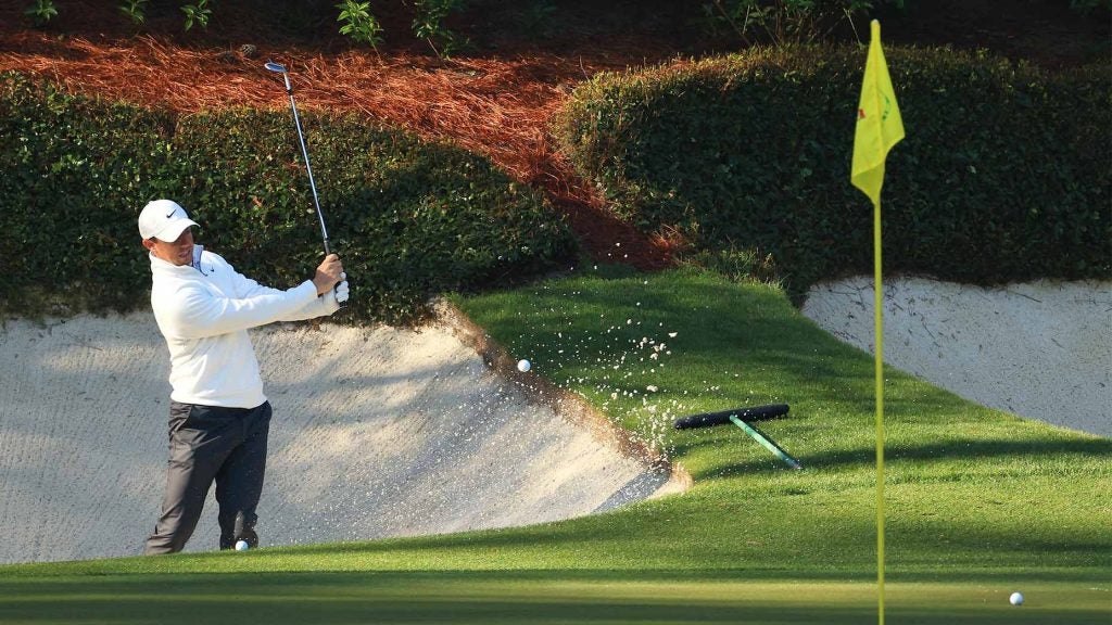 Rory McIlroy splashes out of the bunker at the 2021 Masters on Tueday.