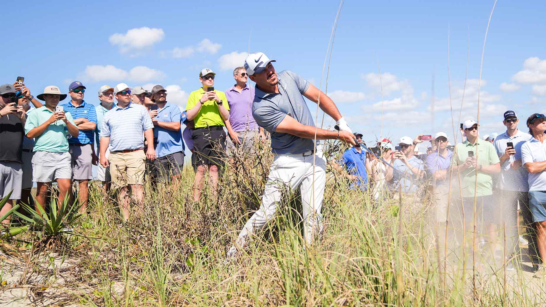 Brooks Koepka hacks out during the first round of the PGA.